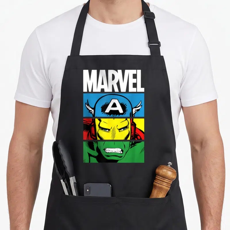 Tablier de cuisine noir avec illustration Captain America Iron Man et Hulk style comics colorés.