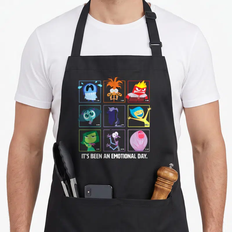 Tablier de cuisine noir avec neuf cases colorées représentant des émotions aux horaires variés et un texte blanc en bas.