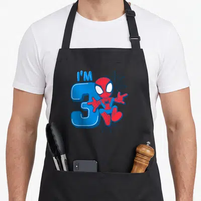 Tablier de cuisine noir avec Spider-Man I'm 3, illustration d'anniversaire enfantine colorée.