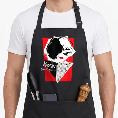 Tablier de cuisine noir avec un collage graphique rouge et noir représentant un visage féminin stylisé et l'inscription Modern Masterpiece.