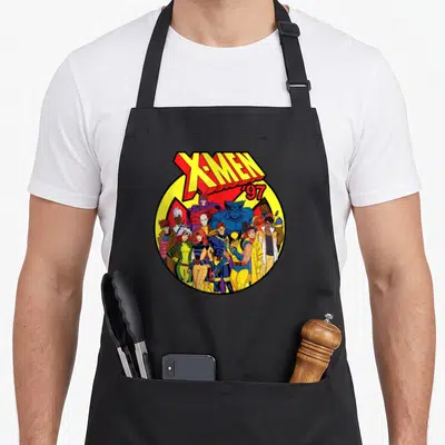 Tablier de cuisine noir avec le logo X-Men '97 et le groupe des mutants en couleurs vives.