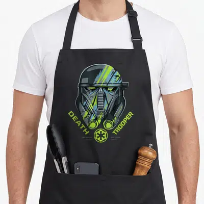 Tablier de cuisine noir avec illustration casque Death Trooper et texte vert fluo Death Trooper Imperial Defense Krennic.
