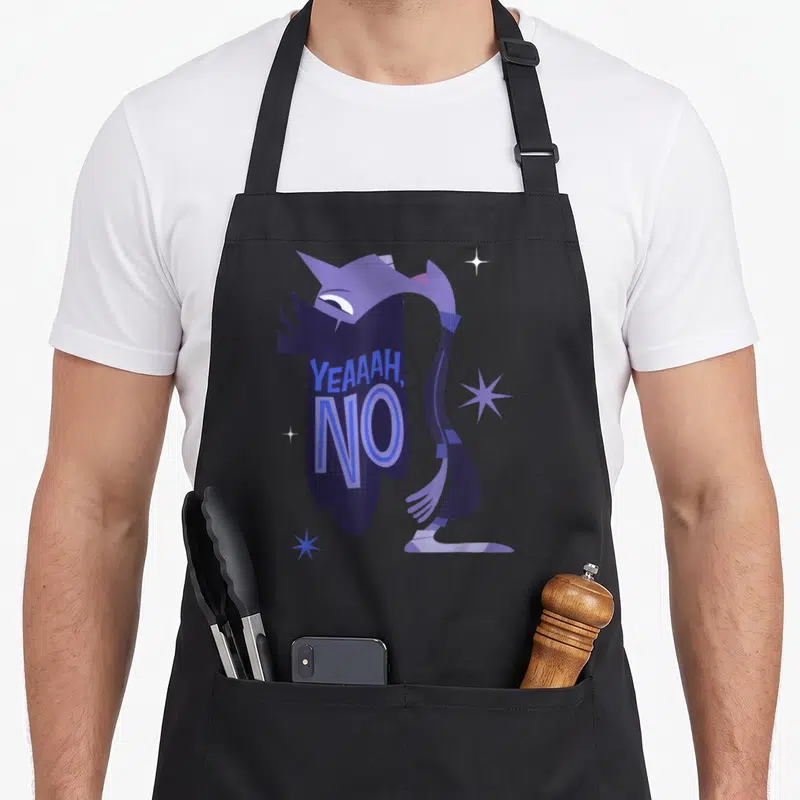 Tablier de cuisine noir avec le personnage Ennui violet et l'inscription YEAH, NO en bleu.