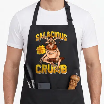 Tablier de cuisine noir avec illustration colorée de Salacious Crumb et texte jaune en lettres capitales.