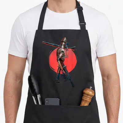 Tablier de cuisine noir avec illustration du droïde IG-11 tenant des armes devant un cercle rouge vif.