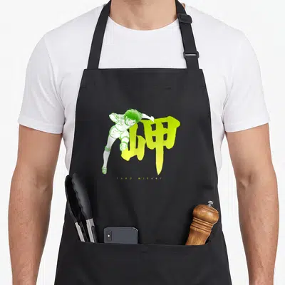Tablier de cuisine noir avec illustration verte de Taro Misaki et le kanji jaune fluo