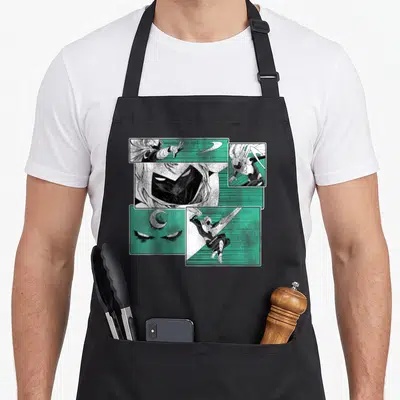 Tablier de cuisine noir avec un motif illustrant Moon Knight sous forme de vignettes de bande dessinée aux couleurs vertes et blanches.