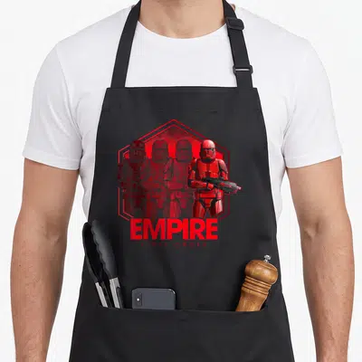 Tablier de cuisine noir avec illustration rouge d'un Sith Trooper et du texte EMPIRE FIRST ORDER.