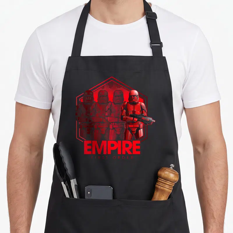 Tablier de cuisine noir avec illustration rouge d'un Sith Trooper et du texte EMPIRE FIRST ORDER.