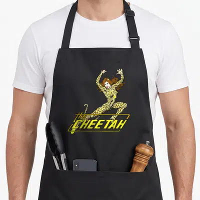 Tablier de cuisine noir avec une illustration colorée de The Cheetah en pose dynamique et son logo jaune retro.