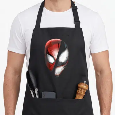 Tablier de cuisine noir avec illustration géométrique divisée montrant Spider-Man et Venom en confrontation.
