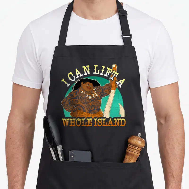 Tablier de cuisine noir avec illustration de Maui tenant une arme et le texte I Can Lift a Whole Island.