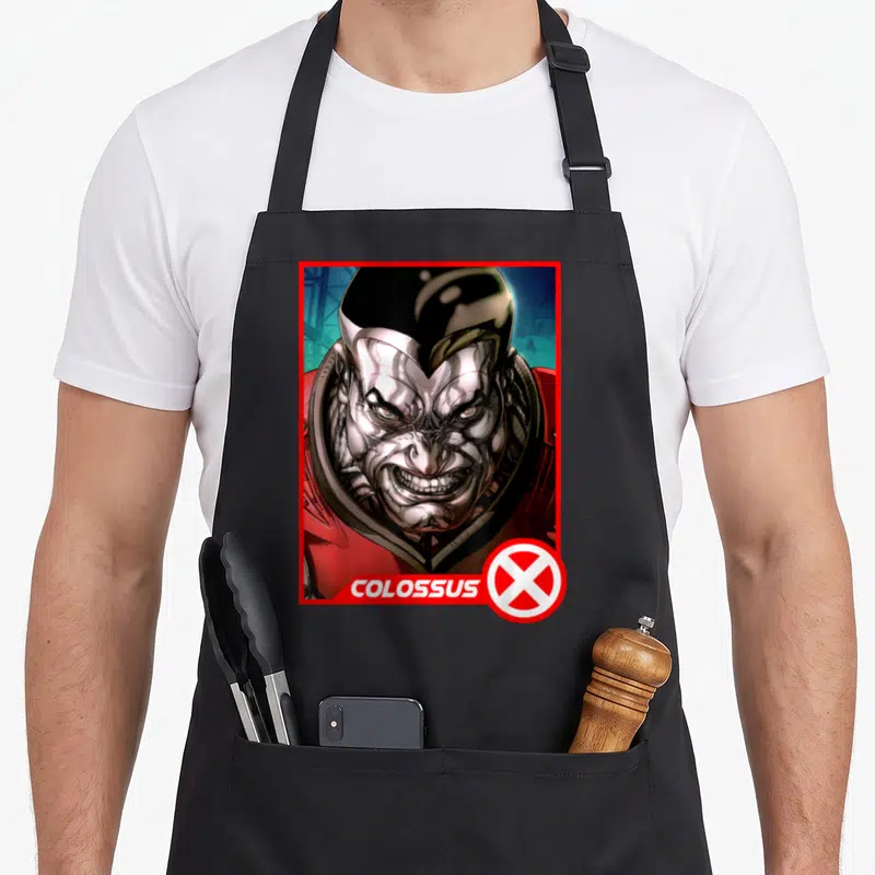 Tablier de cuisine noir avec portrait de Colossus style carte à collectionner rouge et bleu.
