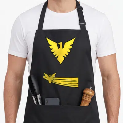 Tablier de cuisine noir avec emblème aigle doré Phoenix et traînée jaune stylisée en bas à droite.