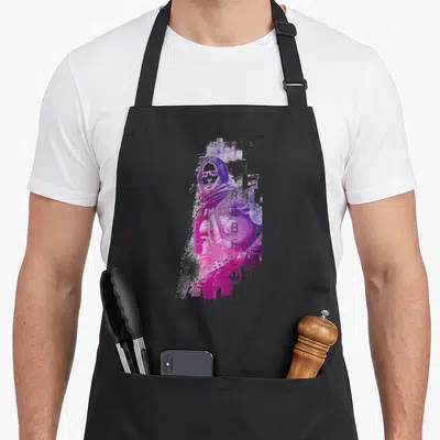 Tablier de cuisine noir avec une illustration rose et violette de Jyn Erso en pose rebelle, style graffiti.