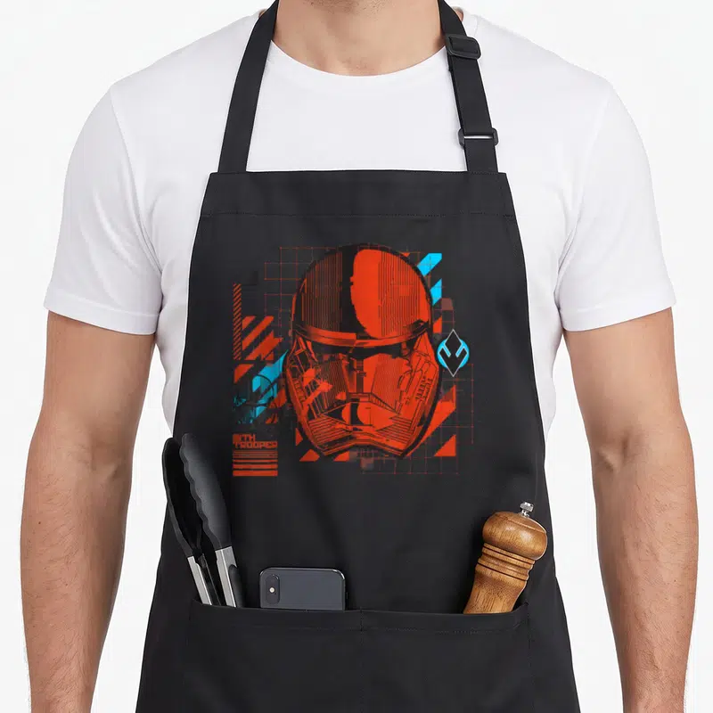 Tablier de cuisine noir avec illustration technique d'un casque Sith Trooper rouge et bleu.