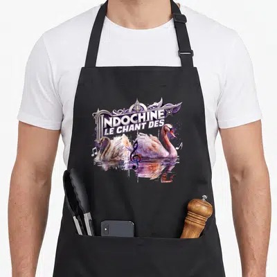 Tablier de cuisine noir avec deux cygnes nageant sous le texte Le Chant des Indochine et une clé de sol multicolore.