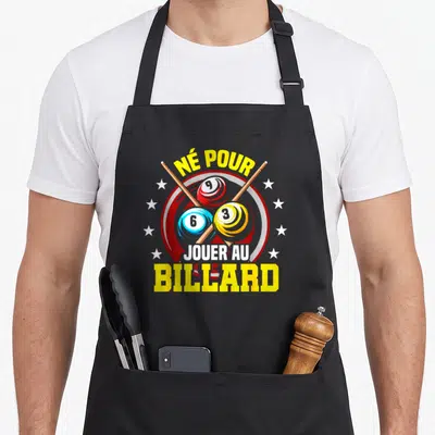 Tablier de cuisine noir avec illustration de balles de billard 9, 6 et 3 croisées sous l'inscription Né pour jouer au billard.