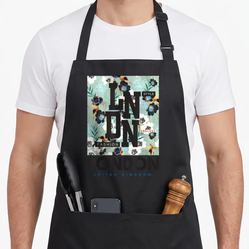 Tablier de cuisine noir avec motif floral de Londres, lettres noires LN DN et mentions Style Fashion England United Kingdom.