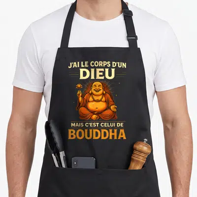 Tablier de cuisine noir avec illustration du Bouddha riant tenant une fleur de lotus et texte humoristique en orange.