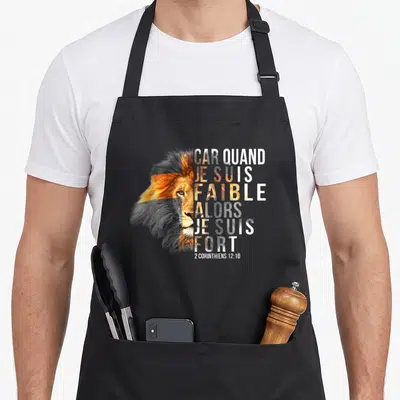 Tablier de cuisine noir avec tête de lion et texte car quand je suis faible alors je suis fort 2 Corinthiens 12:10