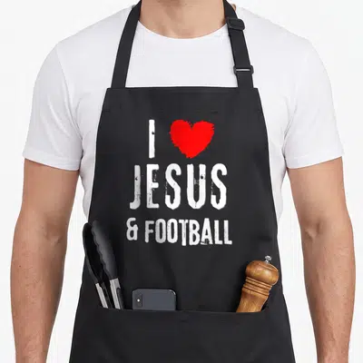 Tablier de cuisine noir avec inscription blanche I Love Jésus & Football et un cœur rouge au style vintage grunge.