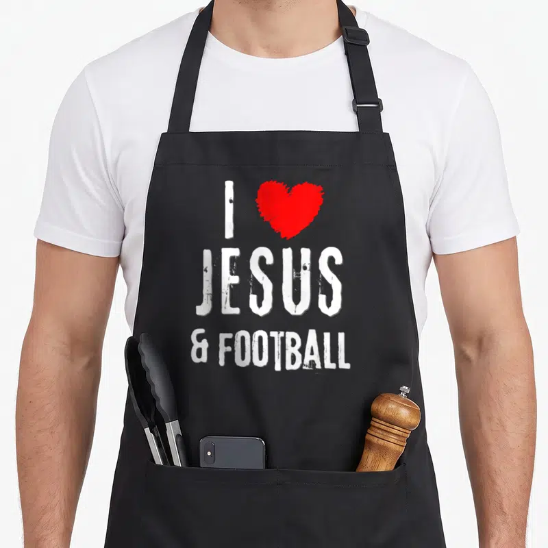 Tablier de cuisine noir avec inscription blanche I Love Jésus & Football et un cœur rouge au style vintage grunge.
