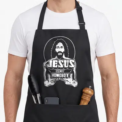 Tablier de cuisine noir avec illustration blanche de Jésus et texte « JESUS IS MY HOMEBOY » au centre.