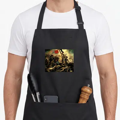 Tablier de cuisine noir avec reproduction de la Liberté qui conduit le peuple de Delacroix imprimée sur le devant.