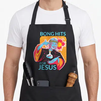 Tablier de cuisine noir avec illustration de Jésus couronné d'épines tenant un bong sur fond rayonnant jaune et rose.