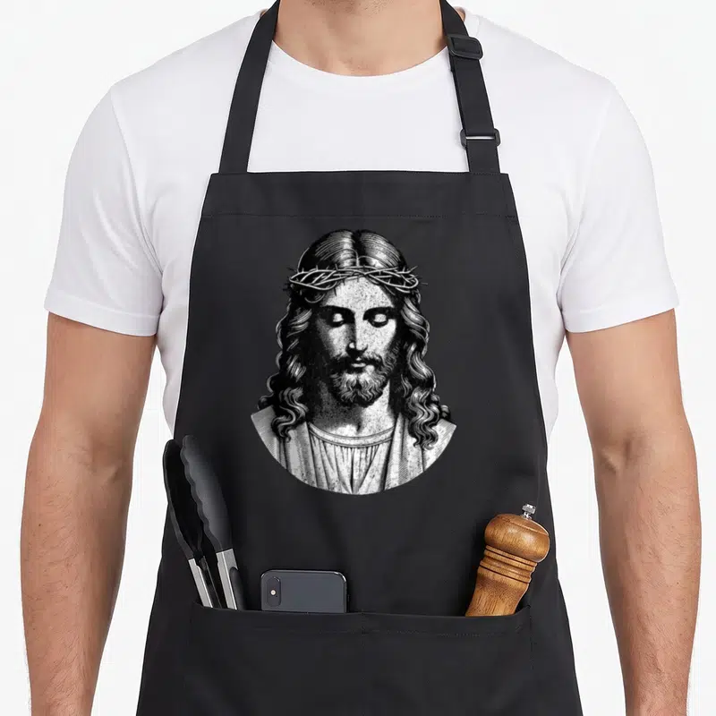 Tablier de cuisine noir avec illustration gravure de Jésus couronné d'épines style vintage.