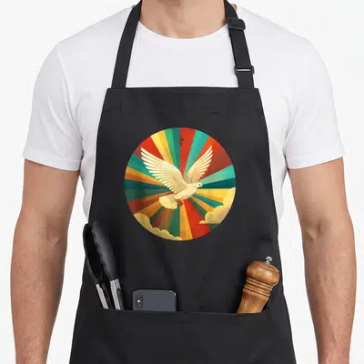 Tablier de cuisine noir avec une colombe blanche et une croix sur des rayons multicolores en cercle.