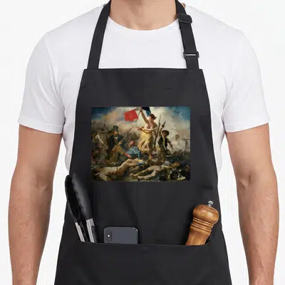 Tablier de cuisine noir avec reproduction de La liberté guidant le peuple de Delacroix imprimée sur le devant.
