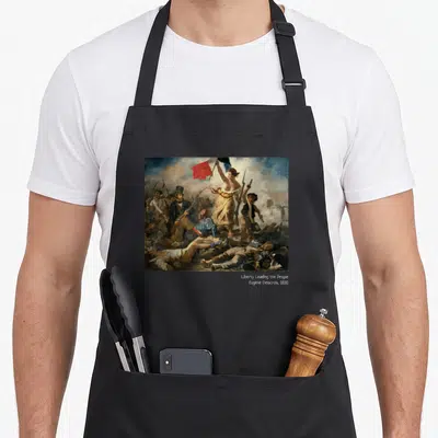 Tablier de cuisine noir avec reproduction du tableau Liberty Leading « the People » de Delacroix en couleur.