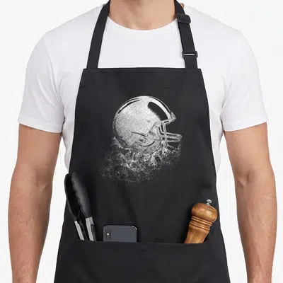 Tablier de cuisine noir avec illustration blanche d'un casque de football américain en style pointilliste.