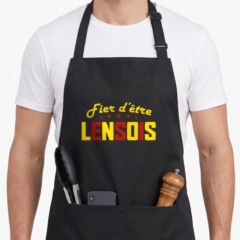 Tablier de cuisine noir avec l'inscription Fier d'être LENSOIS en jaune et rouge surmonté de cinq étoiles.