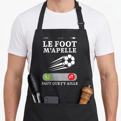 Tablier de cuisine noir avec appel téléphonique Le foot m'apelle et ballon de football en mouvement