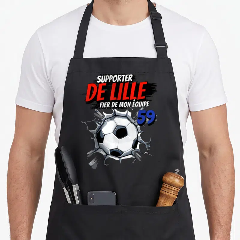 Tablier de cuisine noir avec illustration balle de football brisant un mur et texte Supporter de Lille 59