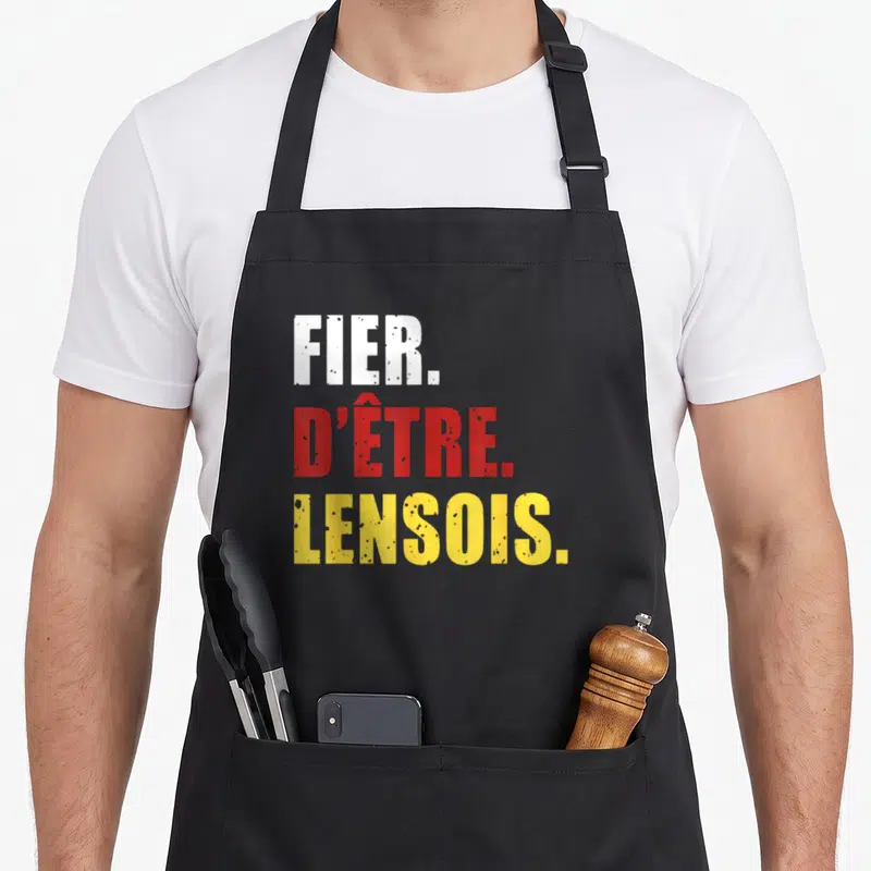 Tablier de cuisine noir avec l'inscription FIER DÊTRE LENSOIS en lettres blanches rouges et jaunes.