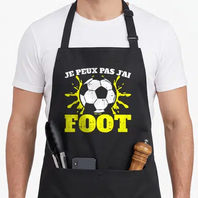 Tablier de cuisine noir avec inscription Je peux pas j'ai foot et illustration de ballon blanc.