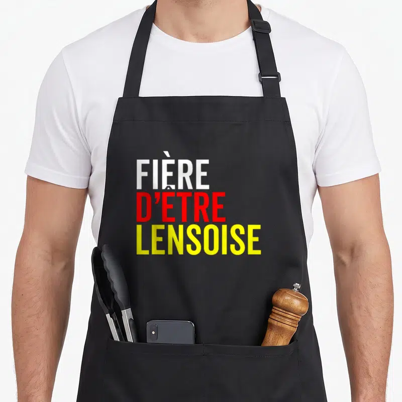 Tablier de cuisine noir avec l'inscription Fière d'être Lensoise en typographie colorée.