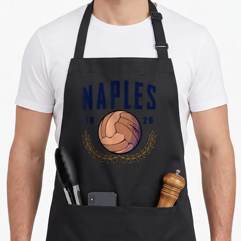 Tablier de cuisine noir avec ballon vintage Naples 1926 et couronne de laurels bleus et dorés.