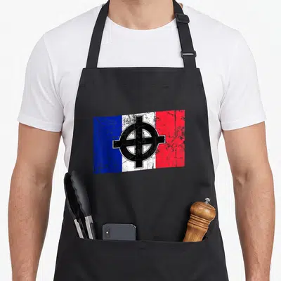 Tablier de cuisine noir avec un motif de drapeau français stylisé par une croix celtique noire au centre.