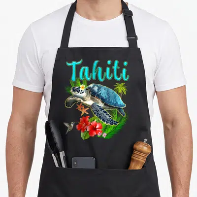 Tablier de cuisine noir avec illustration d'une tortue, d'un colibri, de fleurs rouges et du mot Tahiti en lettres turquoise.