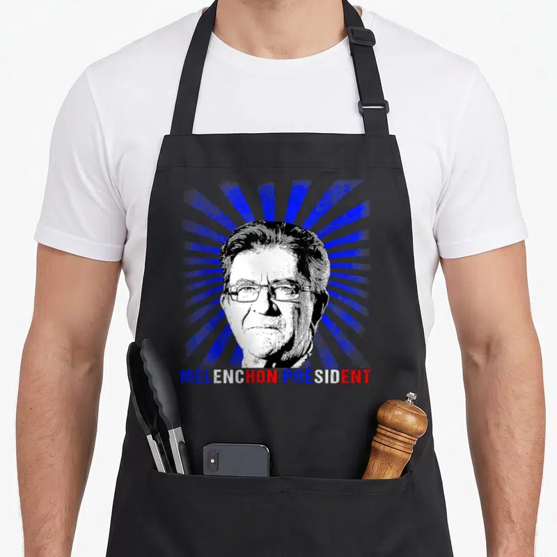 Tablier de cuisine noir avec portrait stylisé de Mélenchon Président et texte tricolore sur fond de rayons bleus.