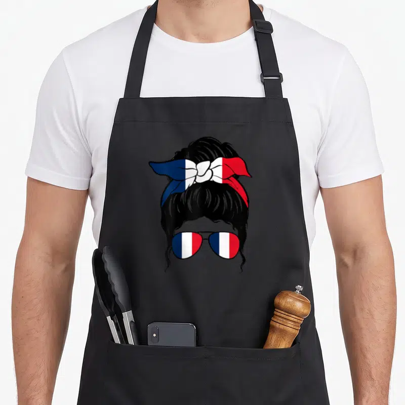 Tablier de cuisine noir avec illustration femme au chignon bandana et lunettes tricolores français