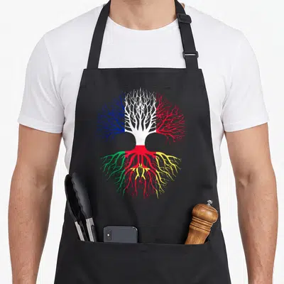 Tablier de cuisine noir avec un arbre aux branches bleue blanche rouge et racines vertes rouges jaunes portant une étoile dorée.