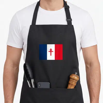 Tablier de cuisine noir avec le drapeau bleu blanc rouge et la croix de Lorraine rouge au centre.