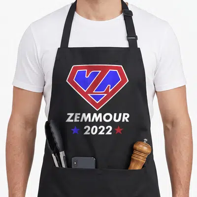 Tablier de cuisine noir avec logo Zemmour 2022 en forme d'emblème de super-héros rouge et bleu.