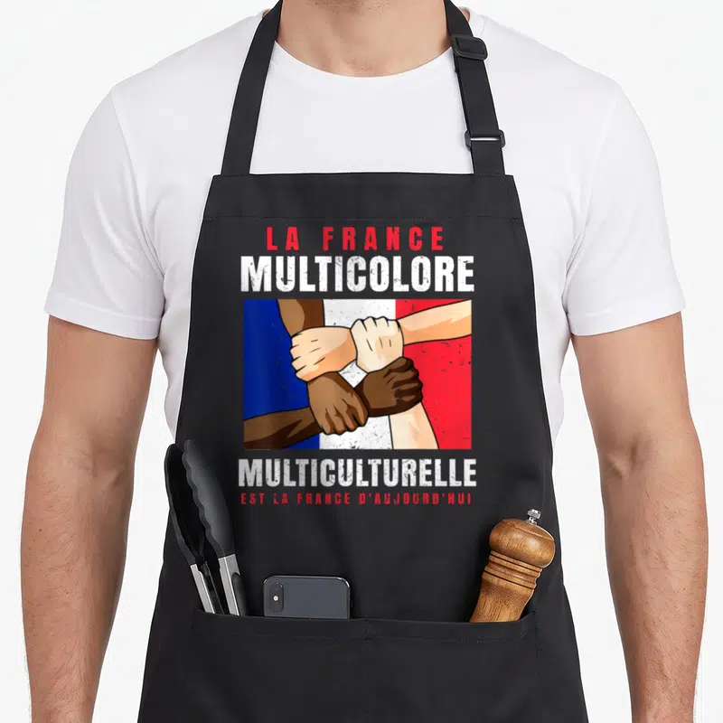 Tablier de cuisine noir avec illustration de bras diversifiés croisés sur drapeau français et texte multicolore multiculturelle